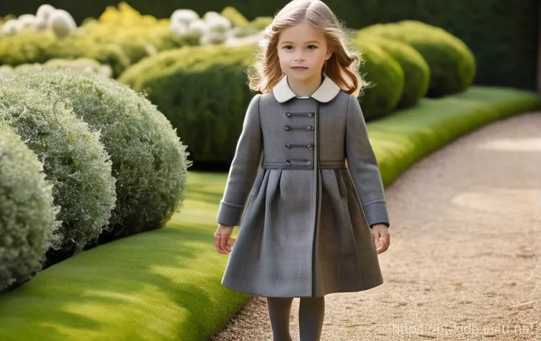 닥스키즈와 빈폴키즈의 차이 - **Daks Kids: Regal Park Stroll**
A young girl, approximately 7 years old, is gracefully walking ...